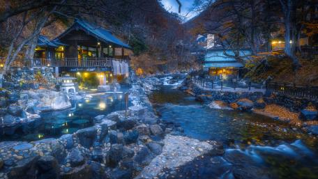 Autumn Serenity at a Riverside Hot Spring Resort wallpaper