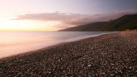 Serene Pebble Beach at Sunset wallpaper