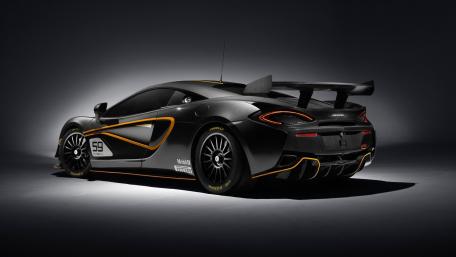 Sleek McLaren 570S in Racing Black and Orange Design wallpaper