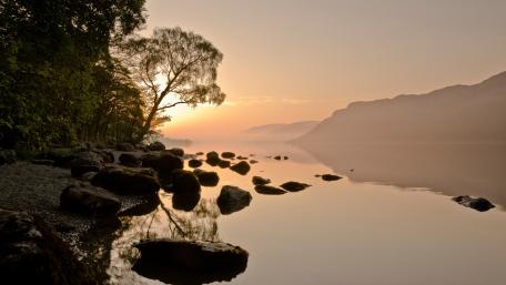 Sunset Serenity Over a Tranquil Lake wallpaper