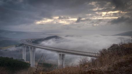 Mysterious Bridge in the Foggy Landscape wallpaper