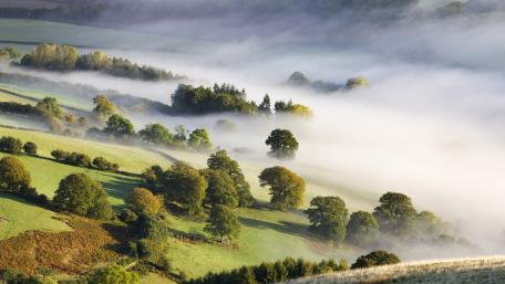 Misty Hills in Enchanting Landscape wallpaper
