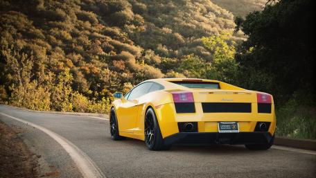 Stunning Yellow Lamborghini Gallardo on Scenic Roadway wallpaper
