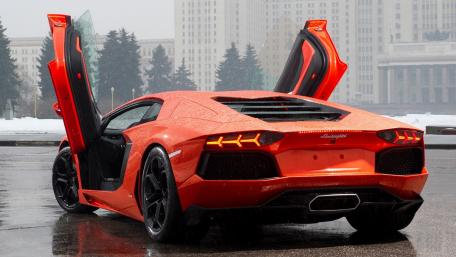 Stunning Red Lamborghini with Scissor Doors wallpaper