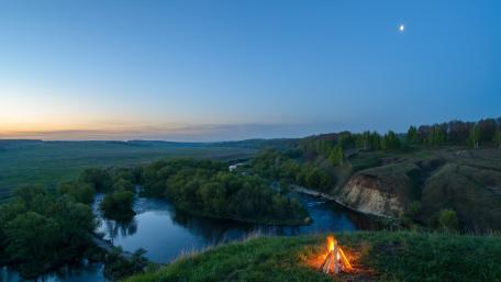 Serene Campfire by the Lake at Dusk wallpaper