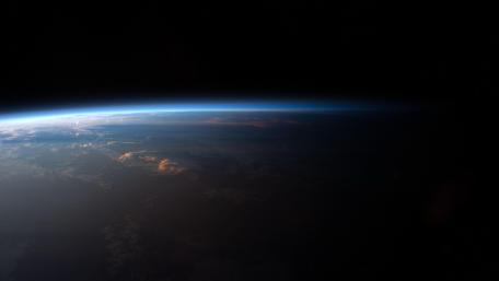 Vast Earth Horizon Under Starlit Skies wallpaper