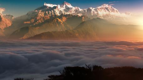Majestic Alpine Sunrise Over Clouds wallpaper
