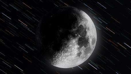 Lunar Spectacle Amidst Streaking Cosmic Rays wallpaper