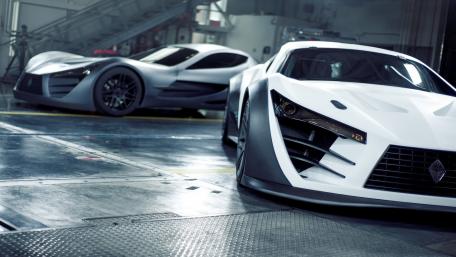 Sleek Supercars in a Dynamic Garage Setting wallpaper