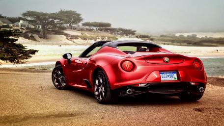 Sleek Alfa Romeo 4C Spider on Coastal Road wallpaper