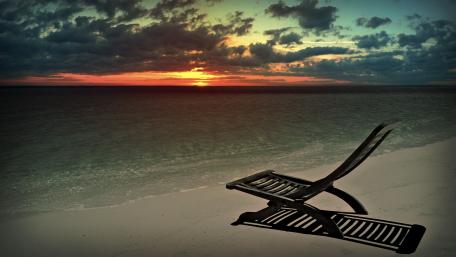 Tranquil Sunset Over Serene Beach Scene wallpaper