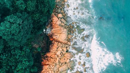Aerial View of Serene Rocky Shoreline wallpaper