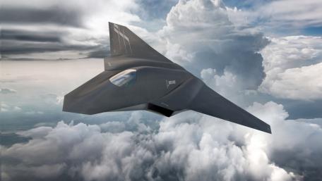 Sleek Jet Soars Above Clouds wallpaper