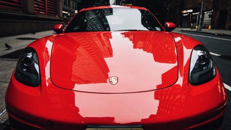 Vibrant Porsche in Urban Landscape wallpaper