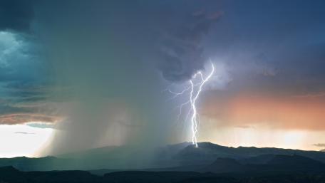 Crackling Thunderbolt Over Majestic Mountains wallpaper