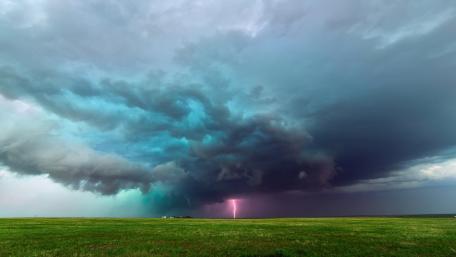 Mesmerizing Stormy Skies with Lightning Strike wallpaper