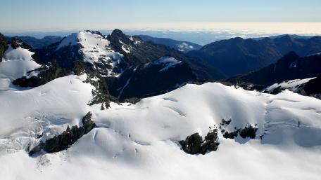 Majestic Winter Mountain Landscape stunning snow-covered peaks stretching into the horizon wallpaper