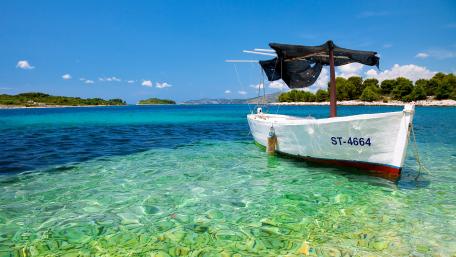 Tranquil Boat on Crystal Clear Waters wallpaper