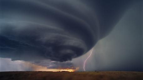 Dramatic Thunderstorm Over Rolling Plains wallpaper