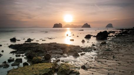 Serene Sunrise Over the Beach and Tide Pools wallpaper