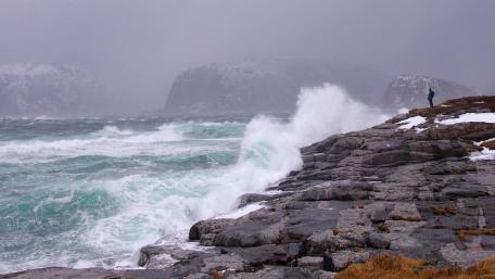 Stormy Waves Crashing Against Rocky Shoreline wallpaper