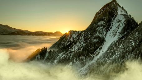 Majestic Mountain Peaks Above the Clouds wallpaper