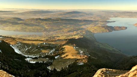 Majestic Mountain Landscape Overlooking Serene Waters wallpaper