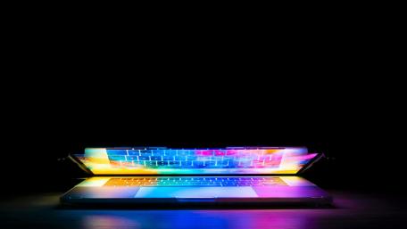 Vibrant Laptop Glow in the Darkness wallpaper