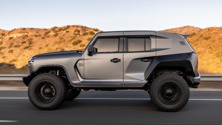 Bold Rezvani Tank on Rugged Terrain wallpaper