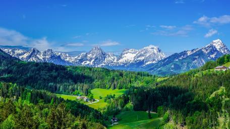 Majestic Alpine Vista Over Lush Valleys wallpaper