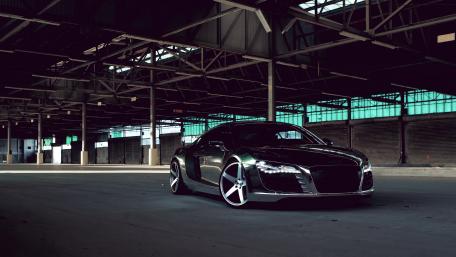 Sleek Sports Car in Industrial Setting wallpaper