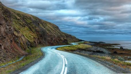 Curvy Coastal Road in Majestic Nature Scene wallpaper