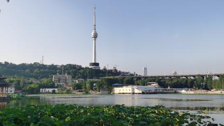 Scenic Cityscape with Tower and Serene Waters wallpaper