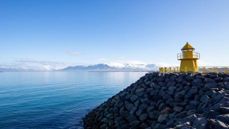 Bright Yellow Lighthouse by Tranquil Sea Scene wallpaper