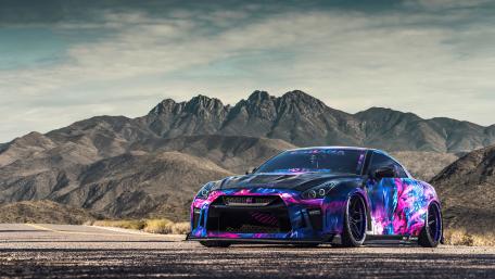 Vibrant Nissan GT-R on Scenic Roadway wallpaper
