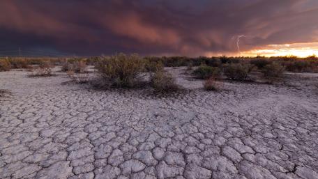 Desolate Desert Under Stormy Skies wallpaper