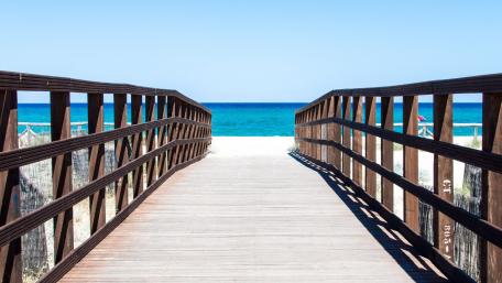 Oceanfront Serenity with a Scenic Boardwalk wallpaper