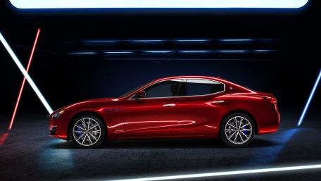 Red Maserati Ghibli in a Stunning Neon Setting wallpaper