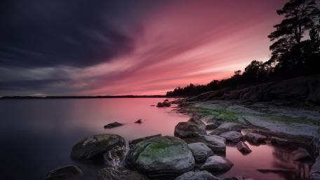 Serene Twilight Over Calm Lake Shoreline wallpaper
