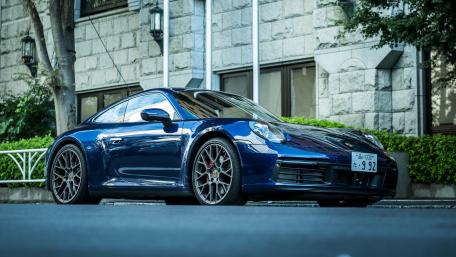 Sleek Blue Porsche 911 Captured in Urban Setting wallpaper