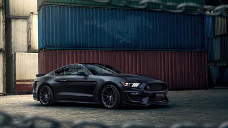 Sleek Ford Mustang Surrounded by Industrial Vibe wallpaper