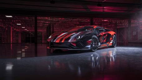 Sleek Lamborghini Aventador S in Stunning Warehouse Setting wallpaper