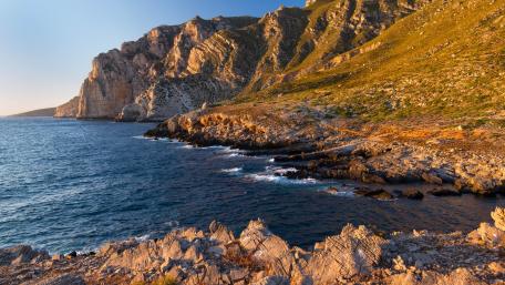 Majestic Cliffs by the Serene Shoreline wallpaper