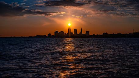 Sunset Silhouette Over the City Skyline wallpaper