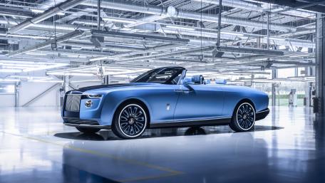 Elegant Blue Rolls-Royce Boat Tail in a Modern Showroom wallpaper