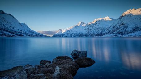 Serene Winter Landscape by Tranquil Blue Lake wallpaper