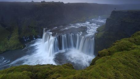 Majestic Serenity of a Waterfall Scene wallpaper