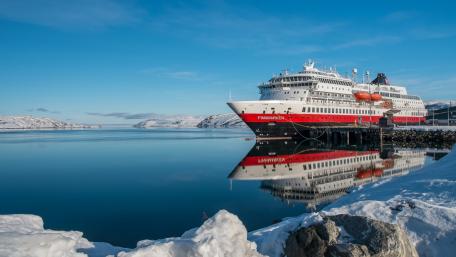 Serene Cruise Ship Reflection in a Winter Landscape wallpaper