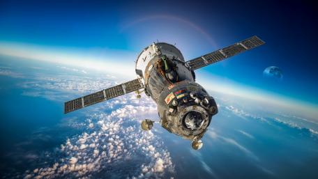 Soaring Above the Clouds in Spacecraft Elegance wallpaper