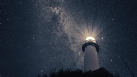 Majestic Lighthouse Under a Starry Sky wallpaper